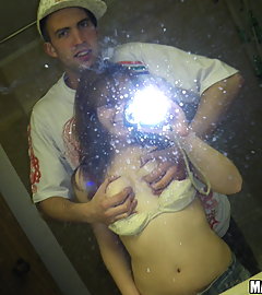 Cute redhead and her BF take pics of her in the bathroom mirror